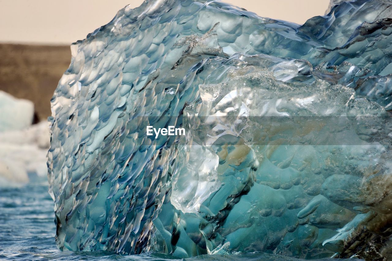 CLOSE-UP OF FROZEN WATER IN SEA