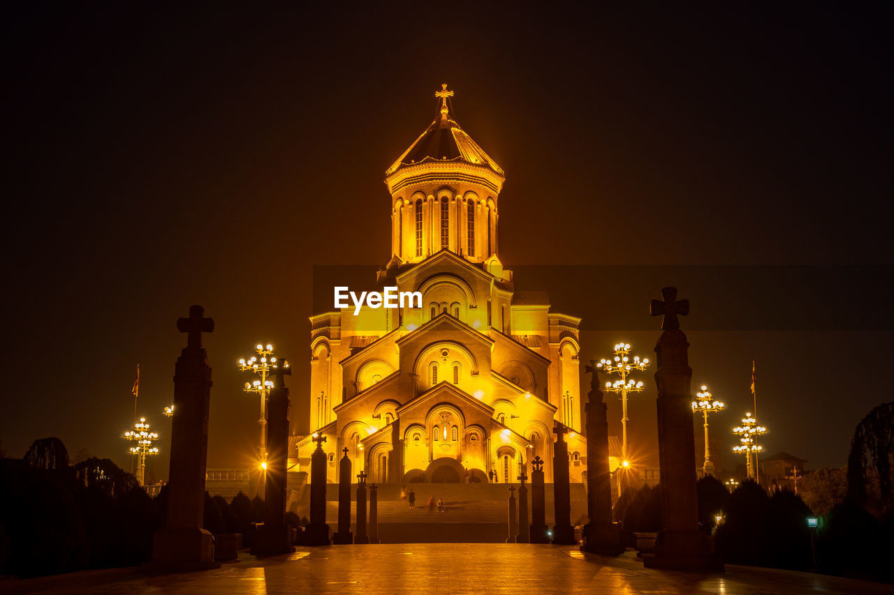 architecture, night, illuminated, built structure, travel destinations, building exterior, landmark, evening, religion, sky, building, city, nature, travel, belief, place of worship, worship, gold, history, tourism, the past, spirituality, no people, light, outdoors, dome, water, dusk, tower