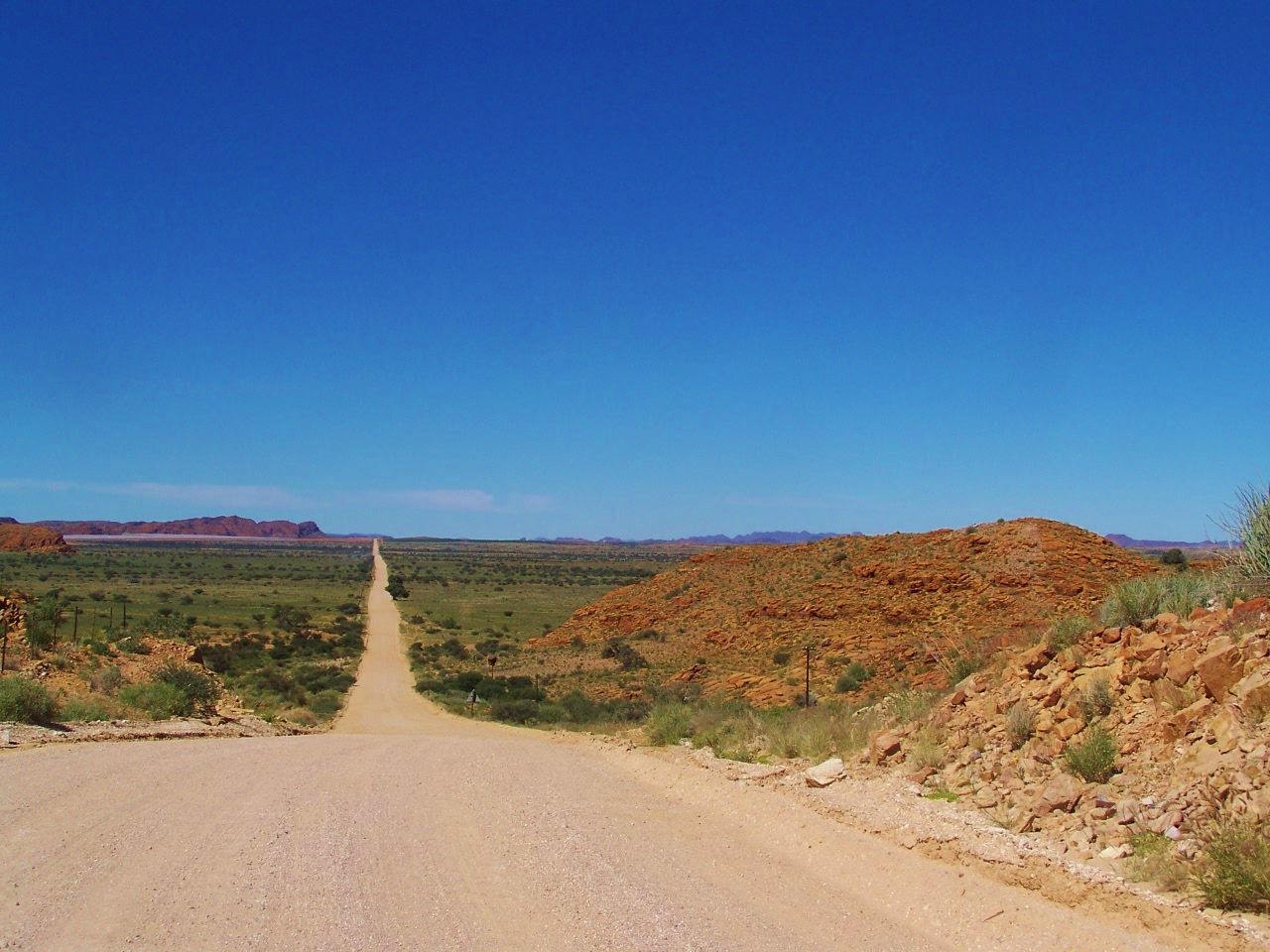 Scenic view of landscape against clear blue sky