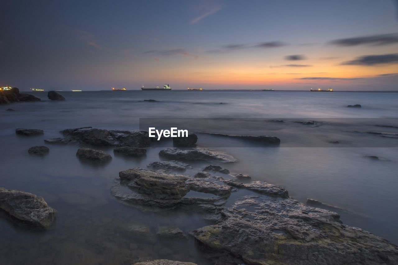 SCENIC VIEW OF SEA DURING SUNSET