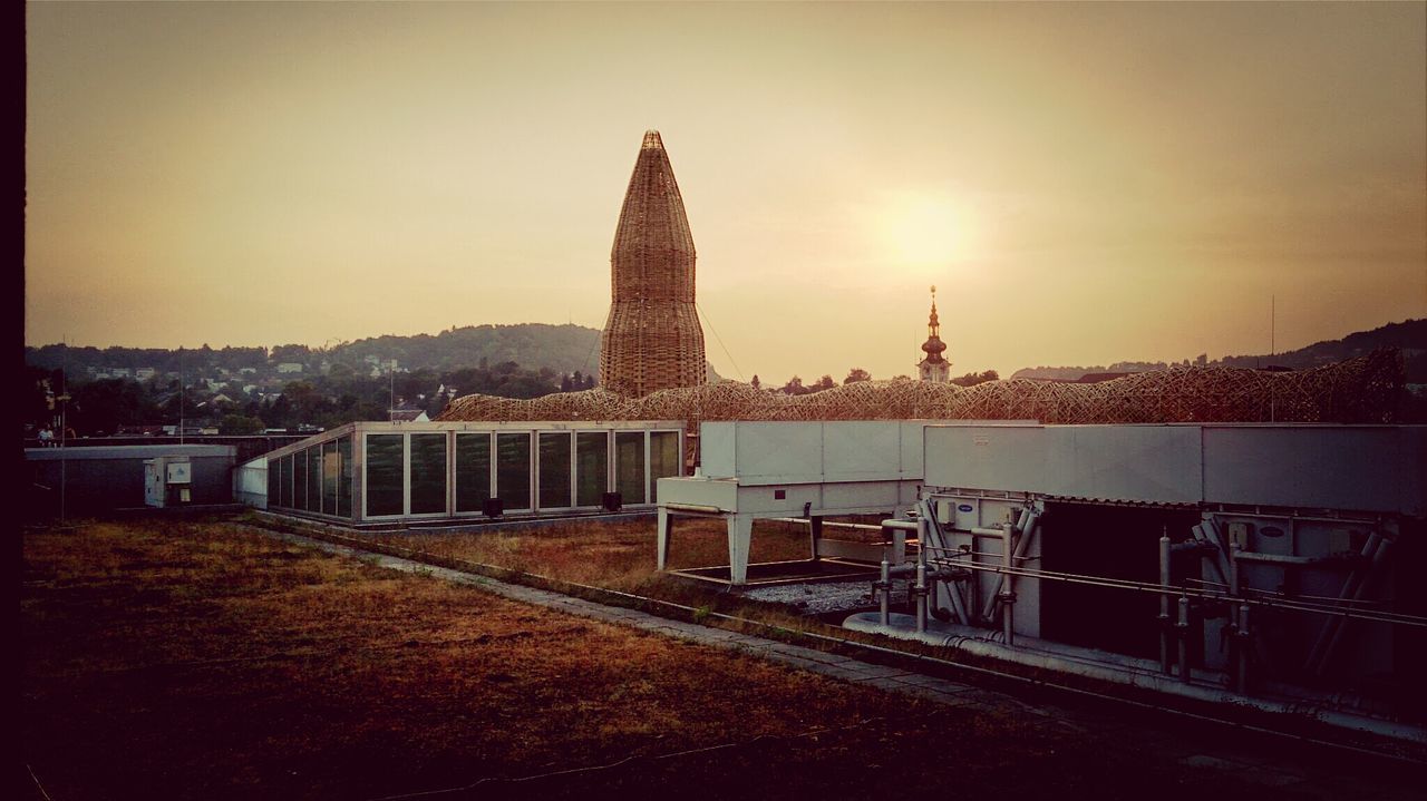 Wicker tower against sky during sunset