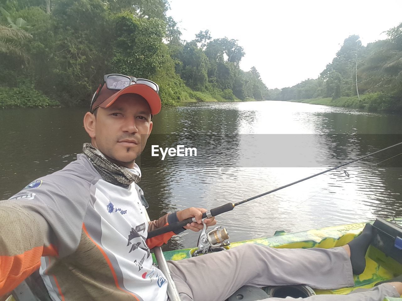 PORTRAIT OF MAN IN LAKE