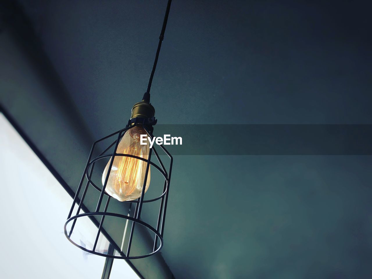LOW ANGLE VIEW OF ILLUMINATED LIGHT BULBS