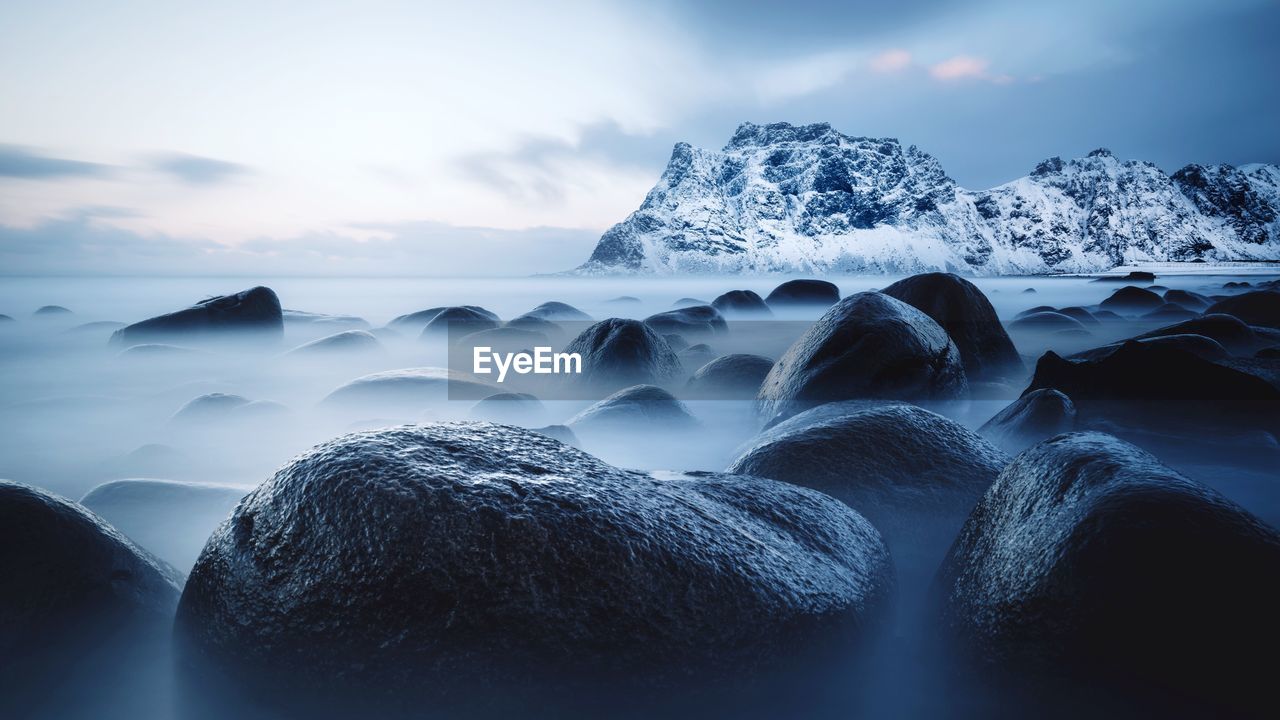 Rocks in sea during winter