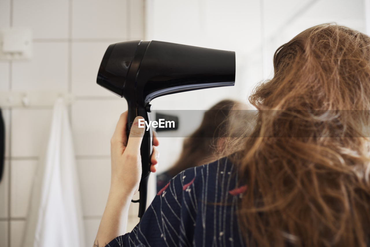 Woman drying hair