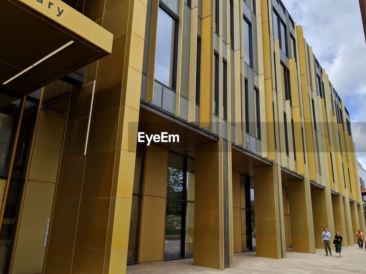 LOW ANGLE VIEW OF YELLOW BUILDINGS IN CITY