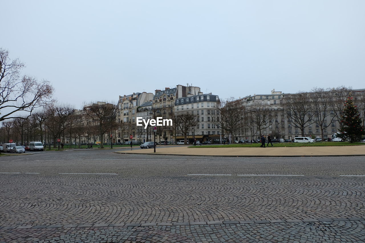 VIEW OF CITY STREET AGAINST CLEAR SKY