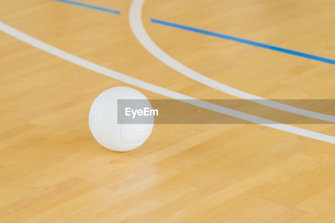 HIGH ANGLE VIEW OF BASKETBALL HOOP ON FLOOR