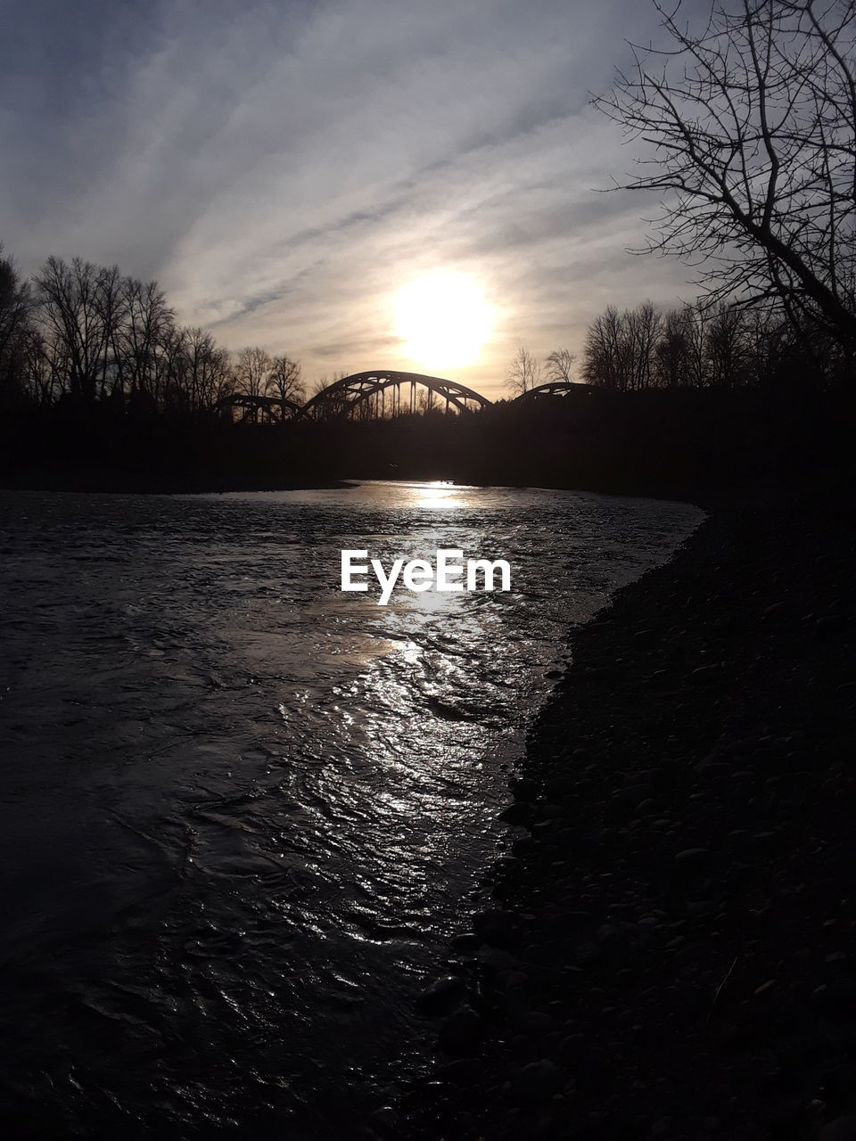 SCENIC VIEW OF SUNSET OVER LAKE