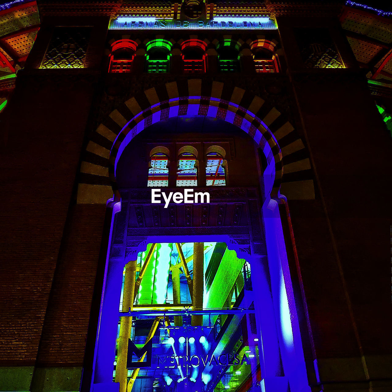 LOW ANGLE VIEW OF ILLUMINATED BUILDING