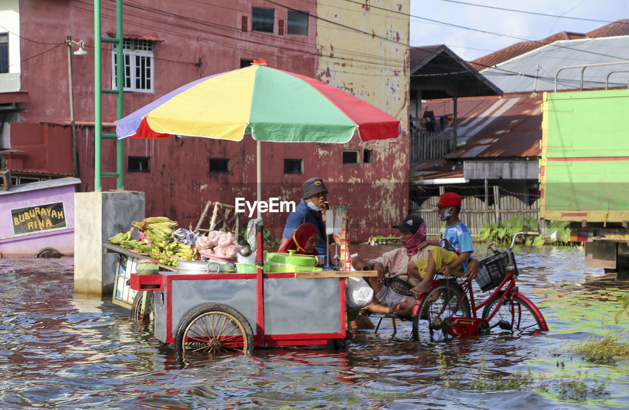 PEOPLE RIDING BICYCLES IN TOWN