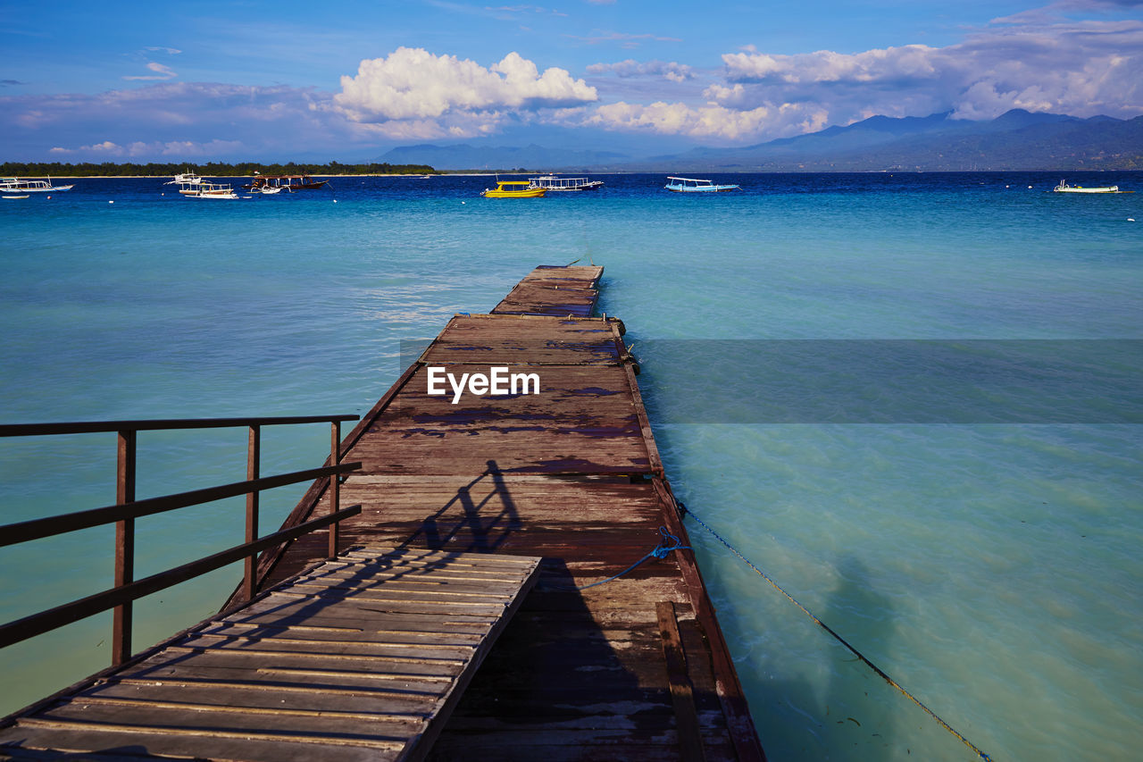 Pier over sea against sky