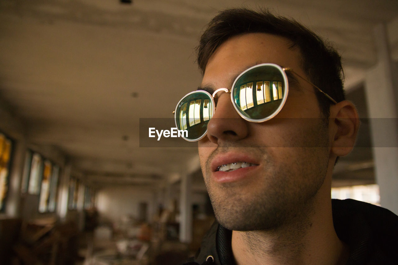 Portrait of teenager wearing mirrored eyeglasses