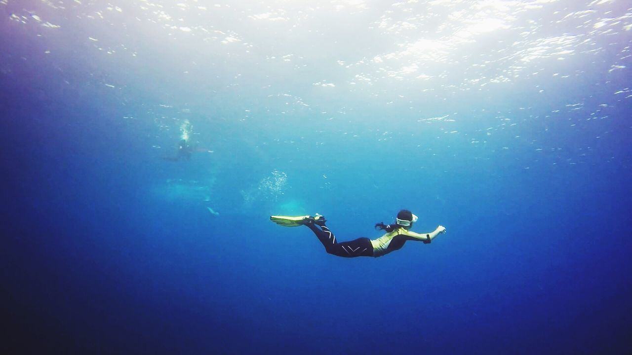 Person diving in sea