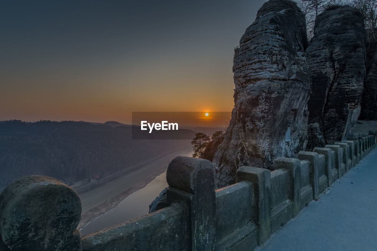 Scenic view of mountains against sky during sunset