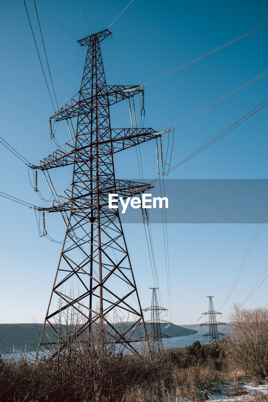 low angle view of electricity pylon
