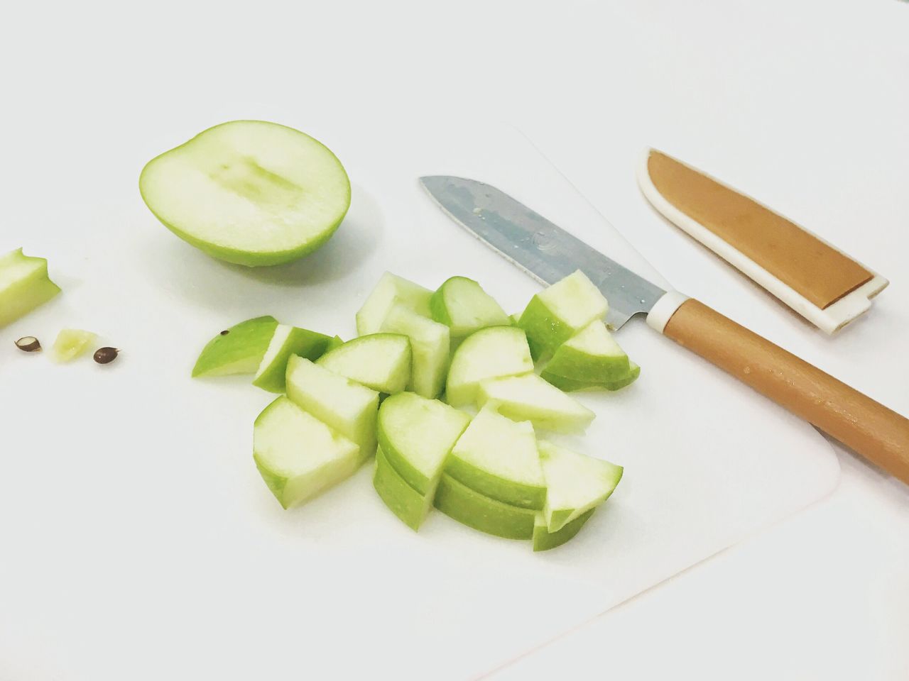 High angle view of granny smith apple slices on table