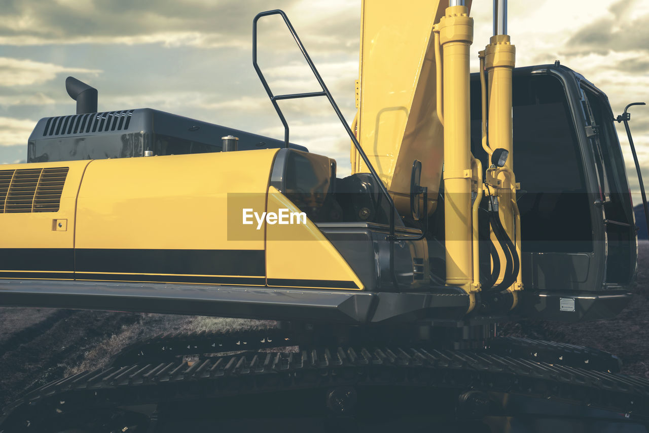 Yellow construction machinery on field