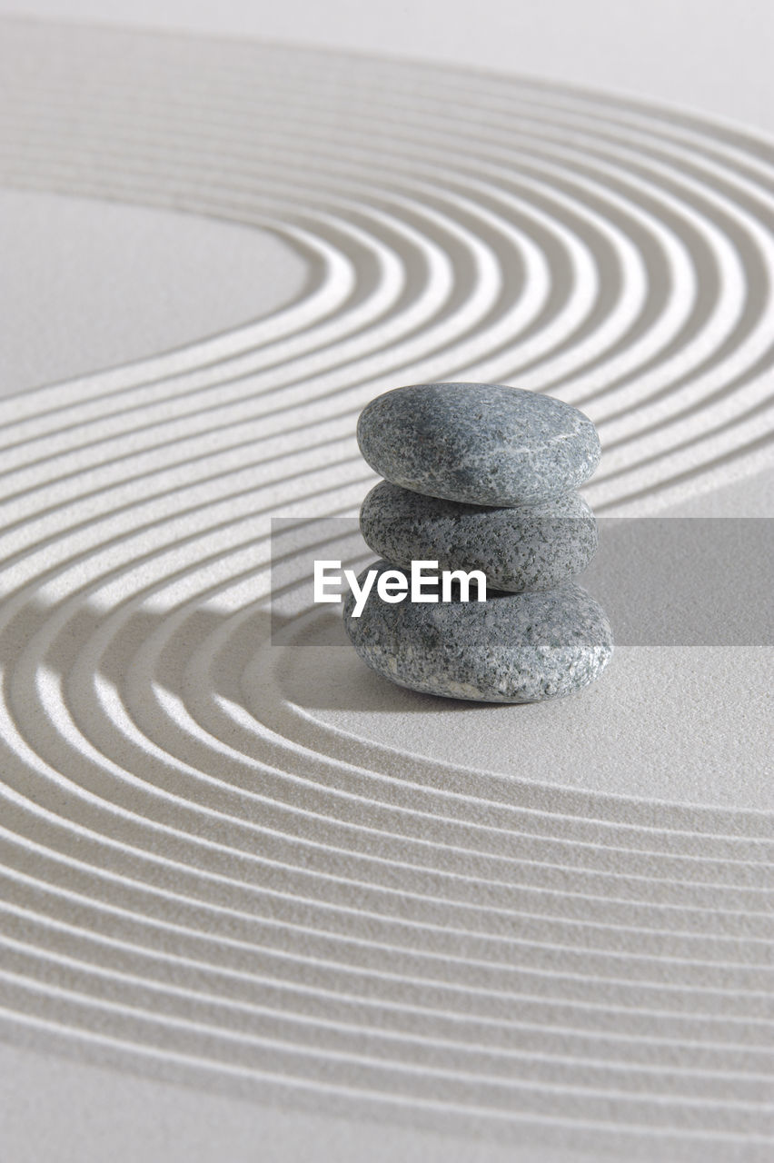 CLOSE-UP OF STACK OF STACKED STONE