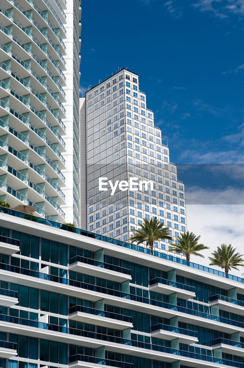 LOW ANGLE VIEW OF MODERN BUILDINGS AGAINST SKY