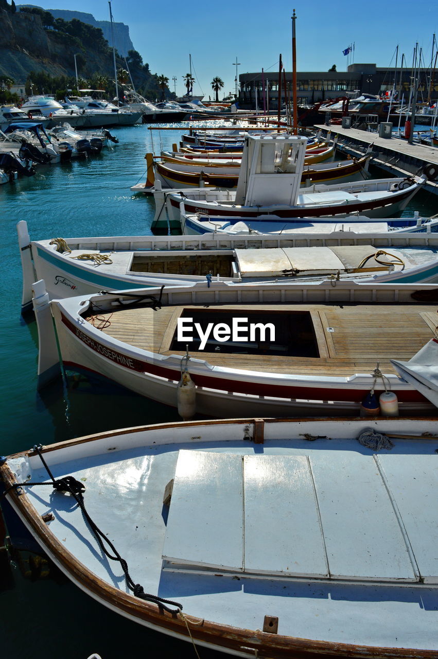 Boats moored at harbor