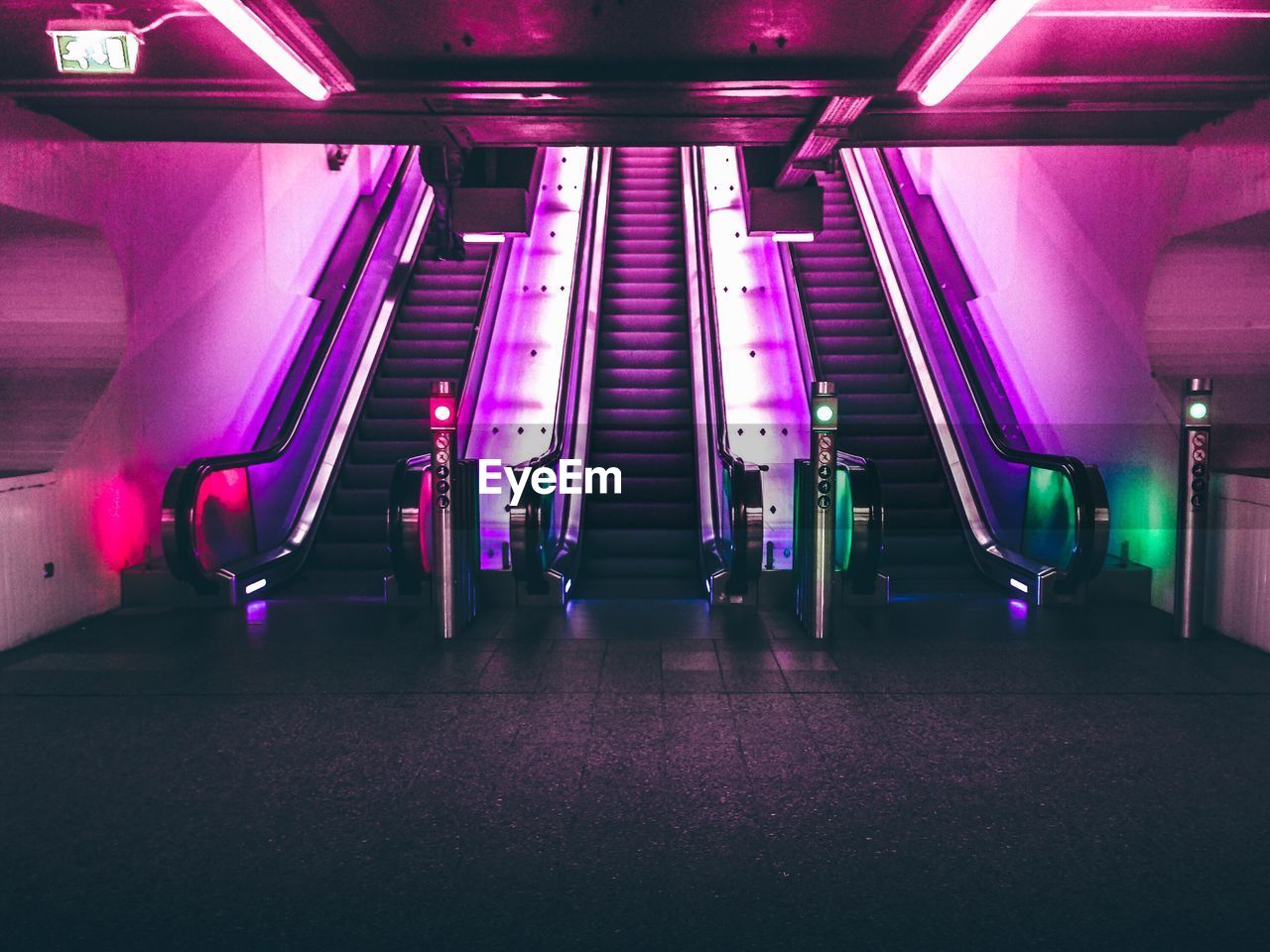 Illuminated escalators at subway station