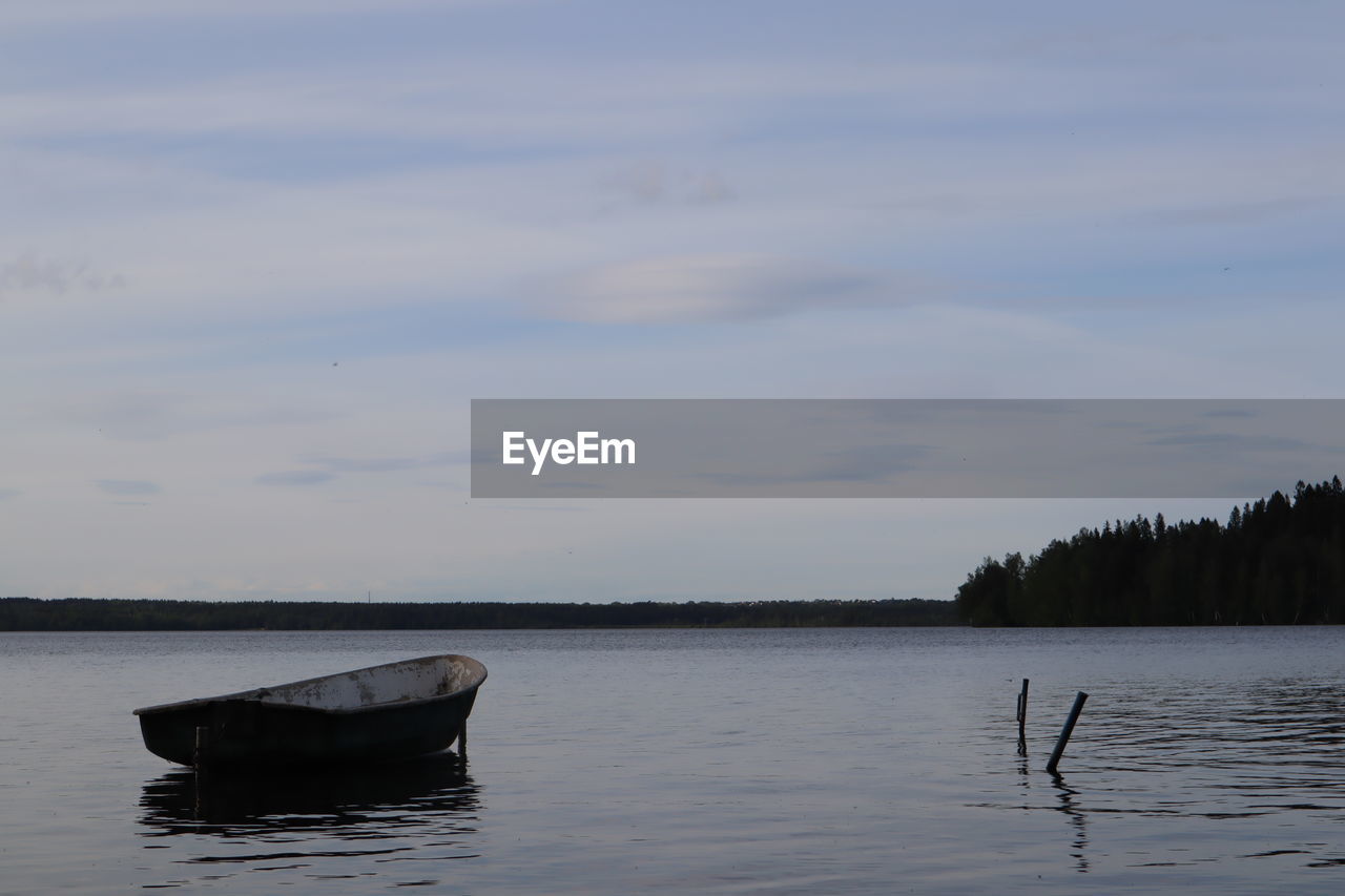 NAUTICAL VESSEL IN LAKE AGAINST SKY