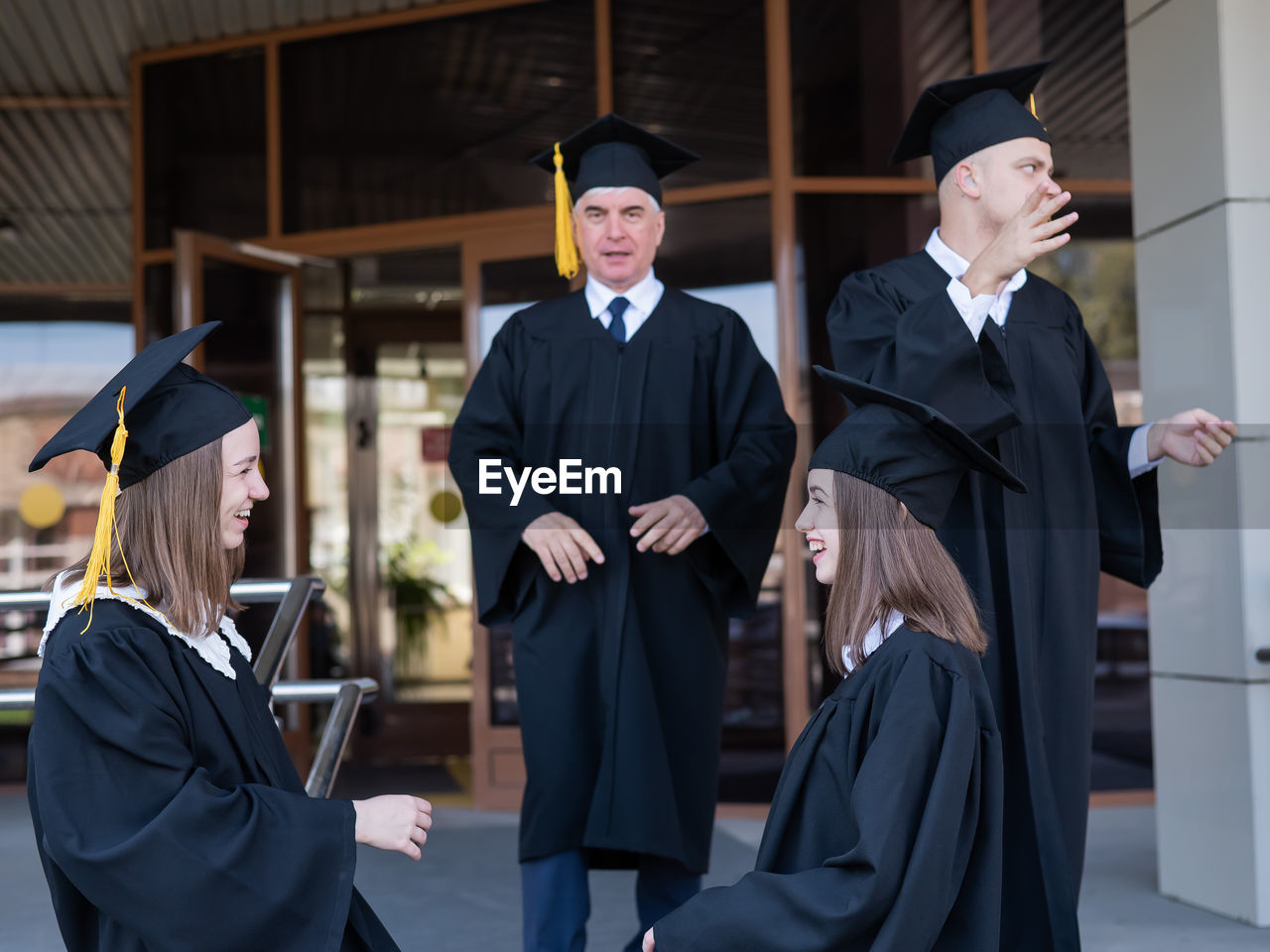 portrait of woman wearing graduation gown