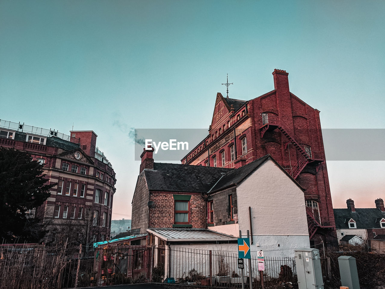 Low angle view of buildings in city against sky