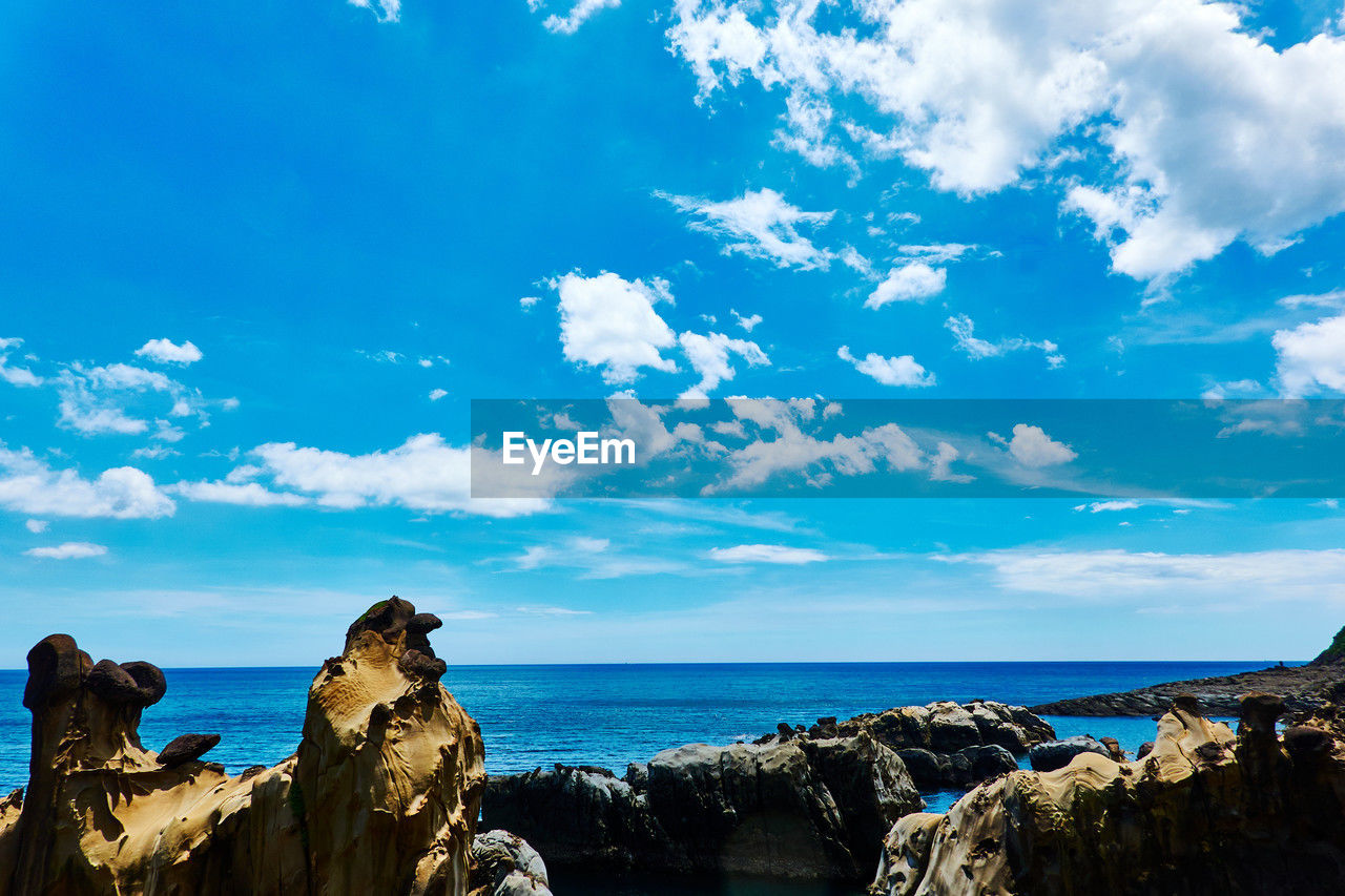 sky, sea, cloud, rock, water, horizon, scenics - nature, nature, land, ocean, beauty in nature, blue, beach, travel destinations, environment, coast, landscape, horizon over water, travel, tranquility, no people, tranquil scene, outdoors, rock formation, shore, vacation, coastline, tourism, cliff, day, seascape, non-urban scene, trip, dusk, holiday