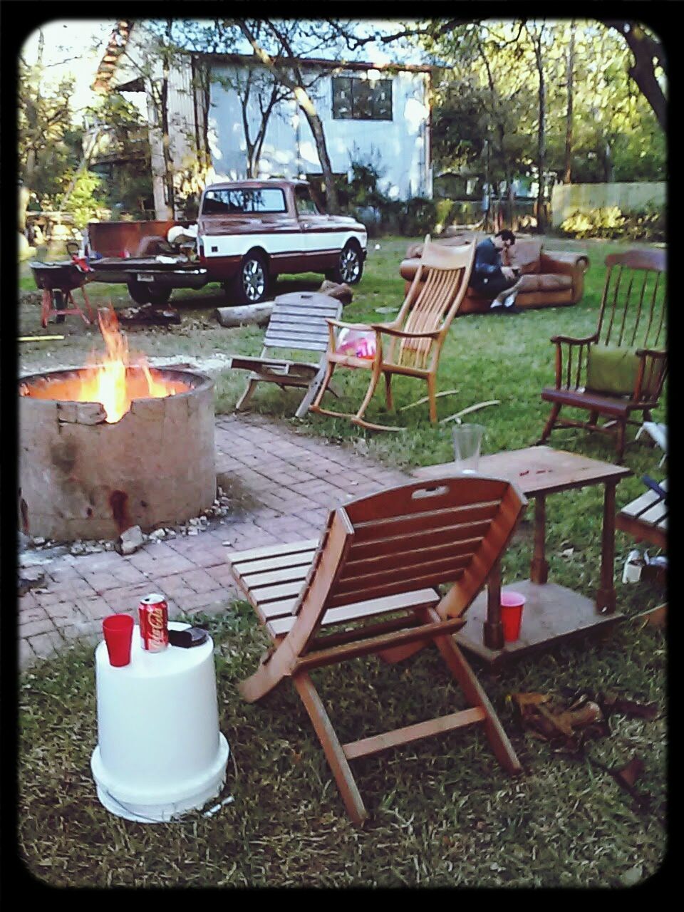 EMPTY CHAIRS IN YARD