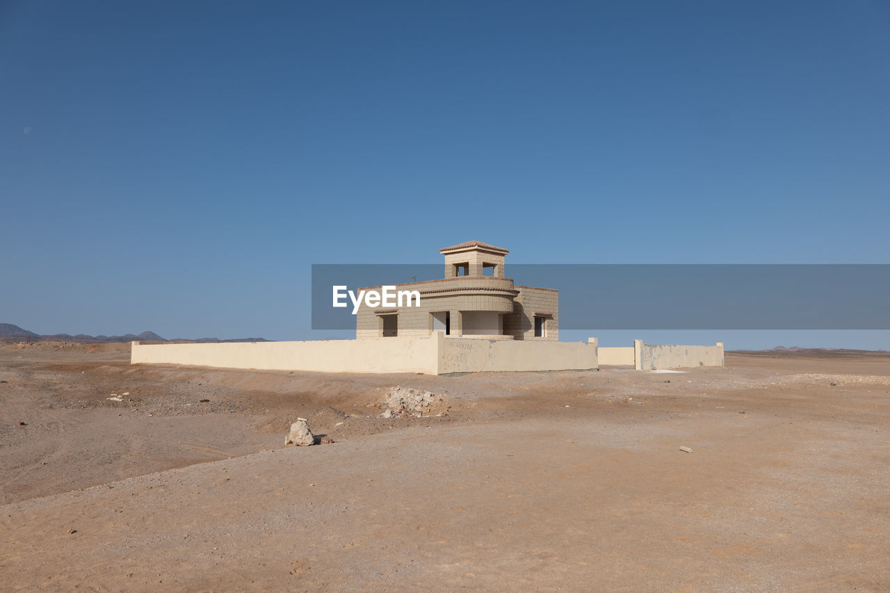 low angle view of old ruins against clear sky