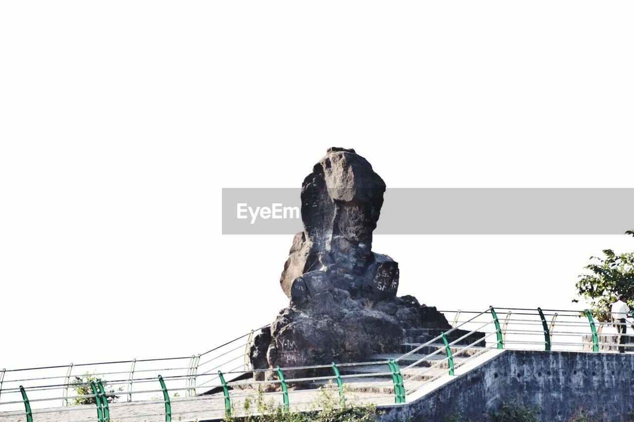 STATUE AGAINST SKY