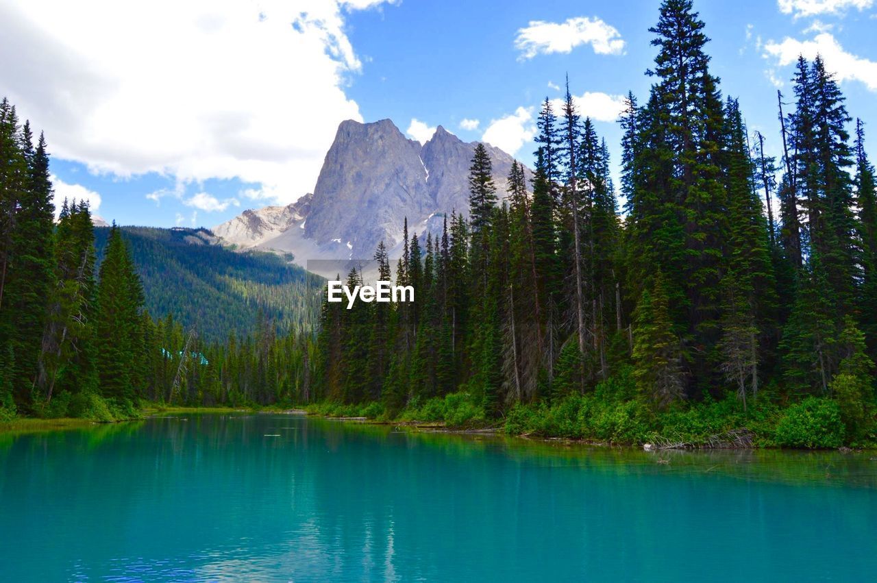 Scenic view of emerald lake against mountains