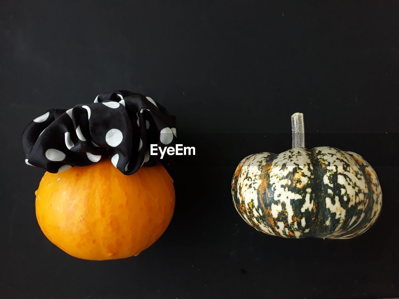 Close-up of pumpkins against black background