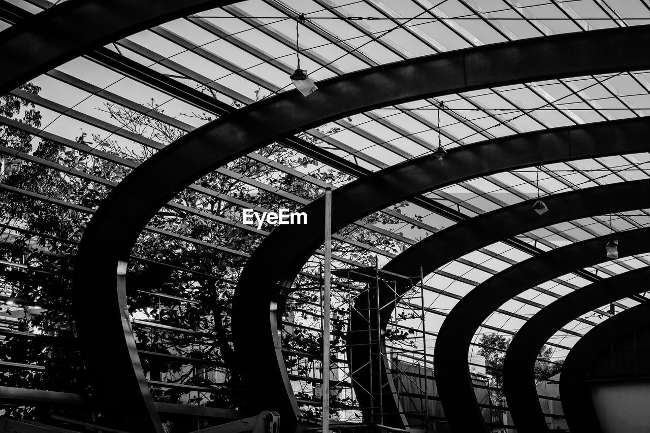 LOW ANGLE VIEW OF RAILROAD STATION SEEN THROUGH WINDOW