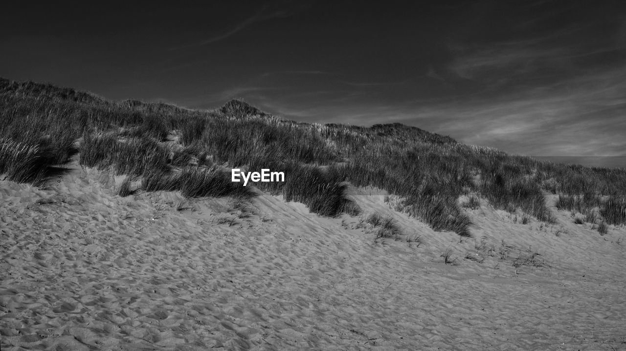 Scenic view of land against sky