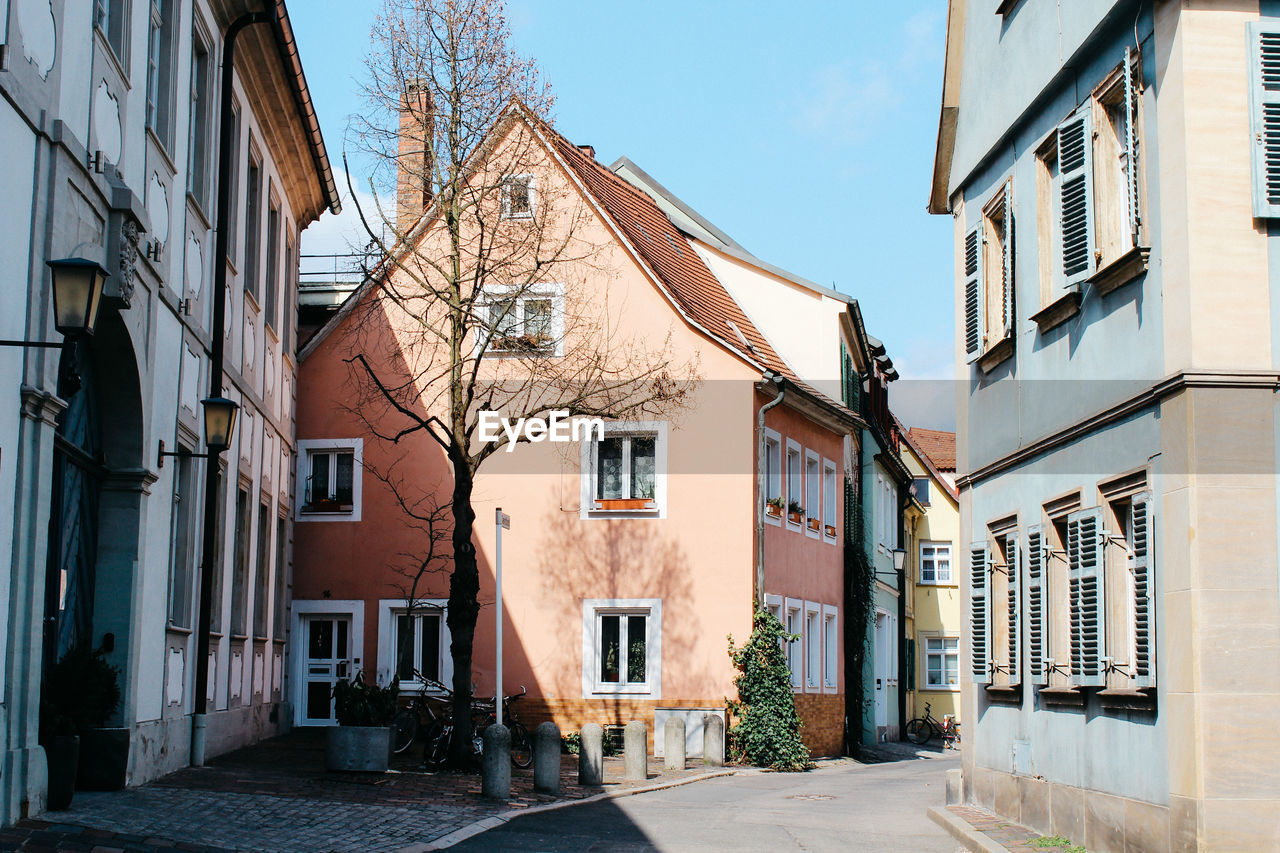 Empty alley amidst residential buildings