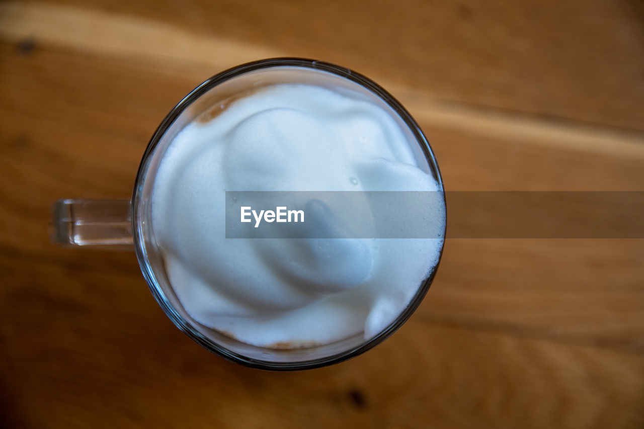 food and drink, drink, refreshment, dairy, milk, indoors, food, drinking glass, table, glass, directly above, household equipment, close-up, wood, freshness, no people, high angle view, still life, breakfast, healthy eating, wellbeing, focus on foreground, cup, cream, whipped cream, frothy drink