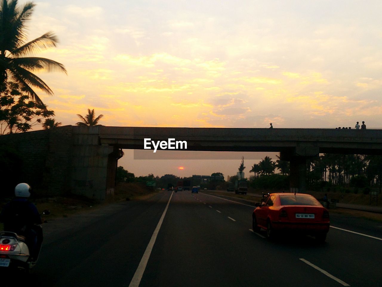 CAR ON ROAD AGAINST SKY