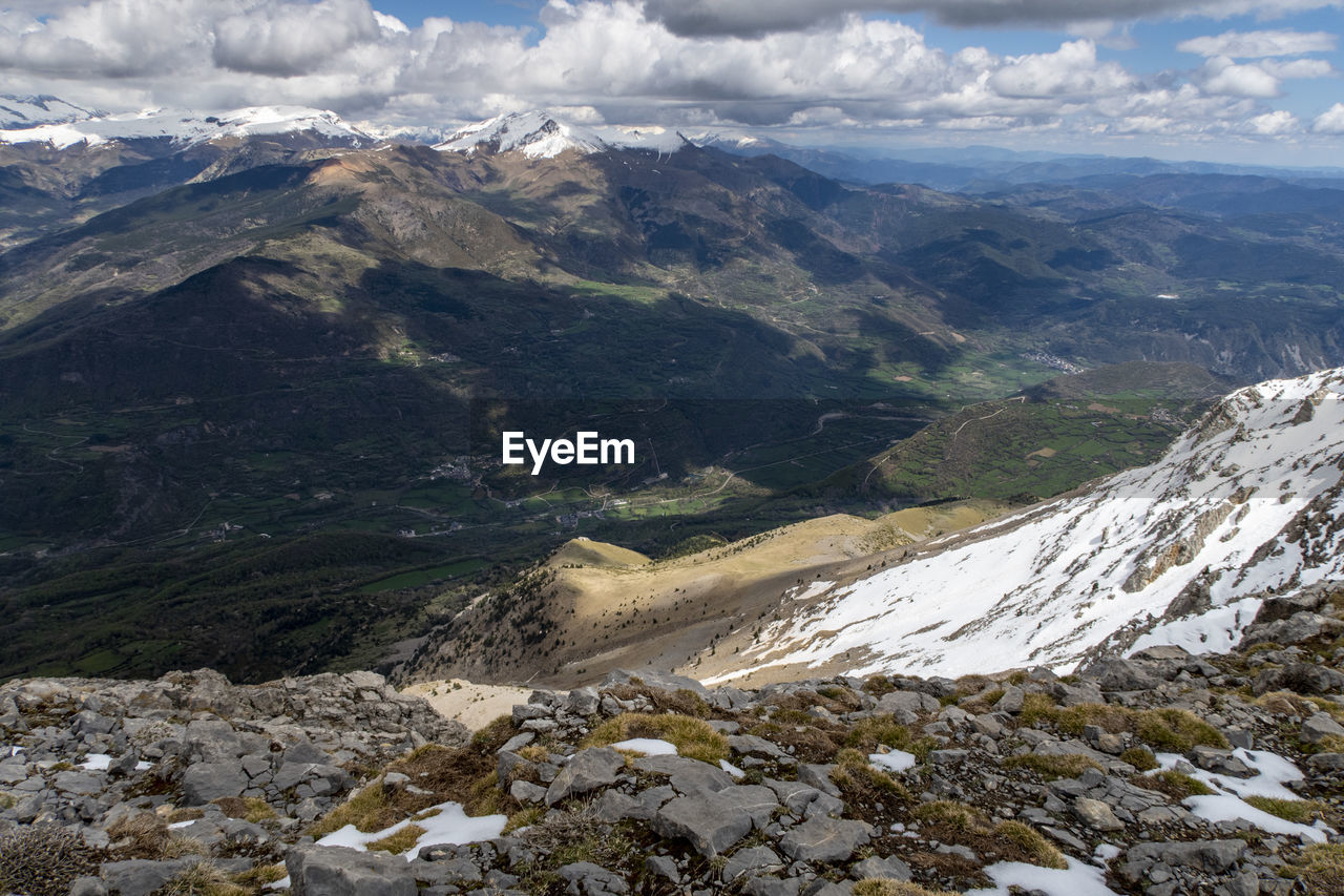 Aerial view of majestic mountains against sky