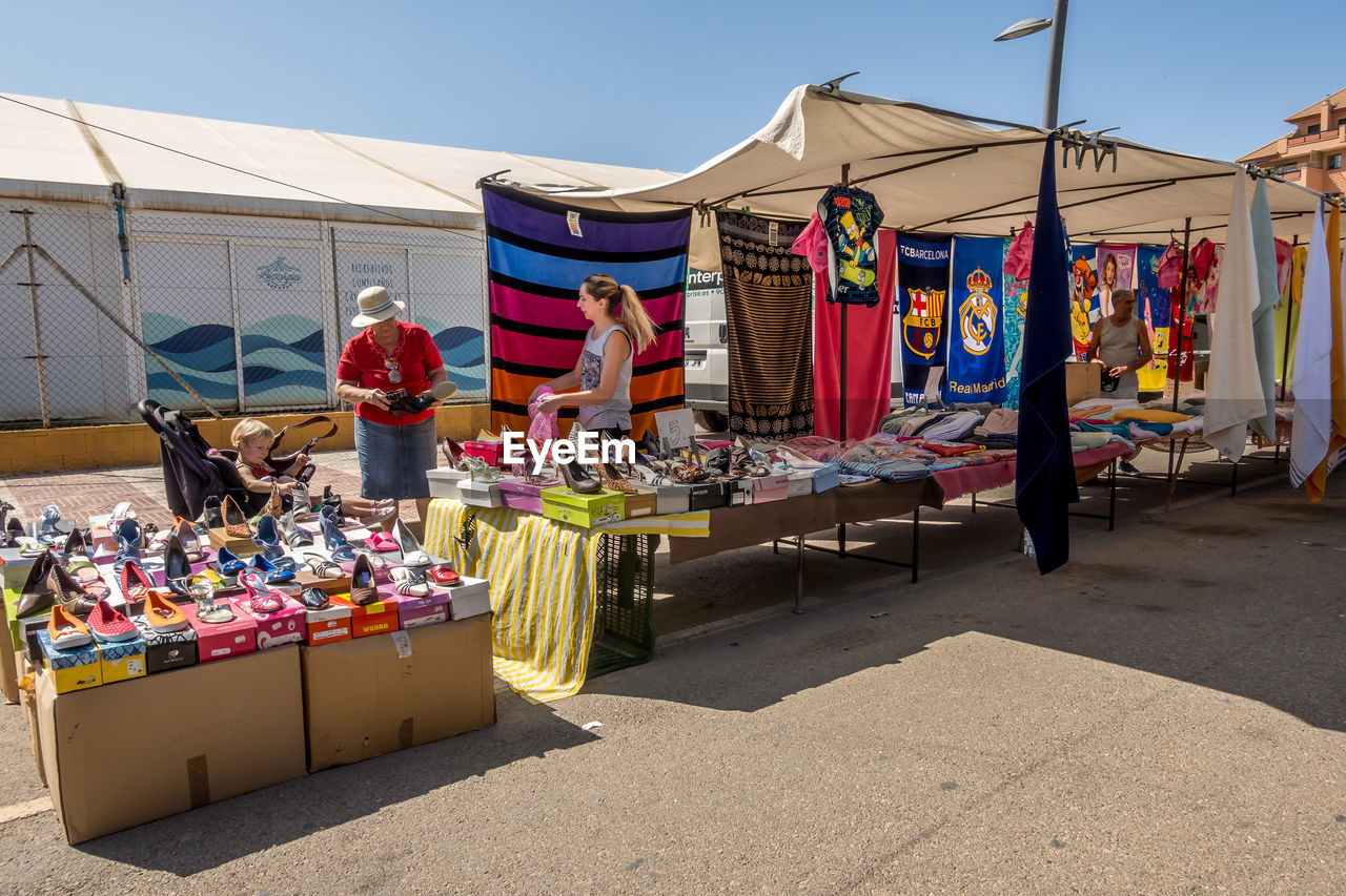 VARIOUS MARKET STALL AGAINST SKY