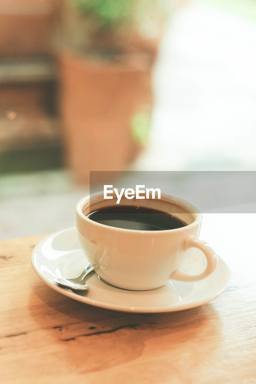 CLOSE-UP OF COFFEE ON TABLE