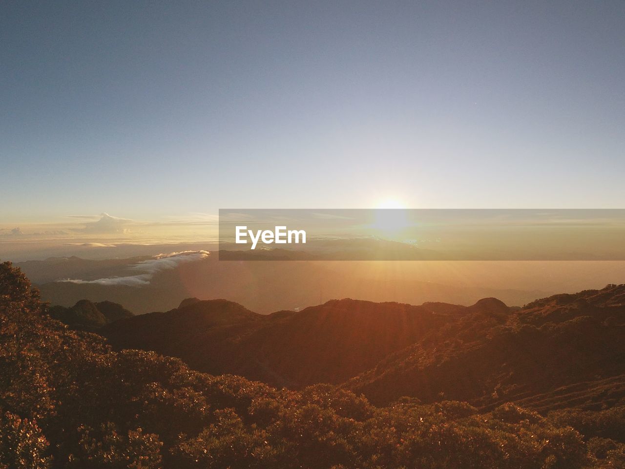 Scenic view of mountains against sky during sunset