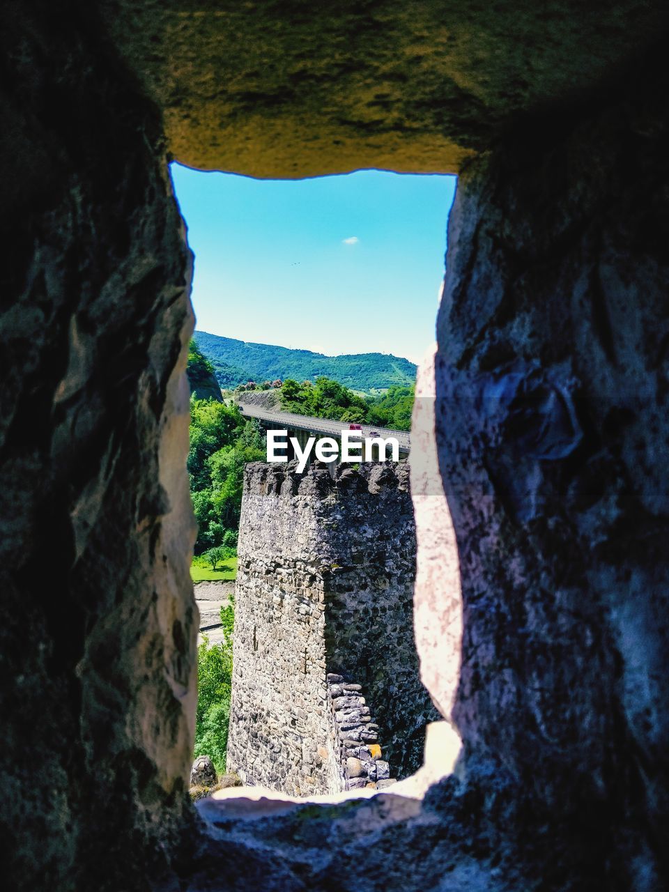 View of stone wall with mountain in background georgia