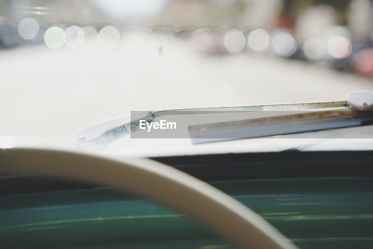 Close-up of car windscreen against blurred background