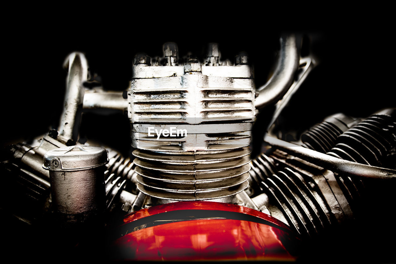 Close-up of engine against black background