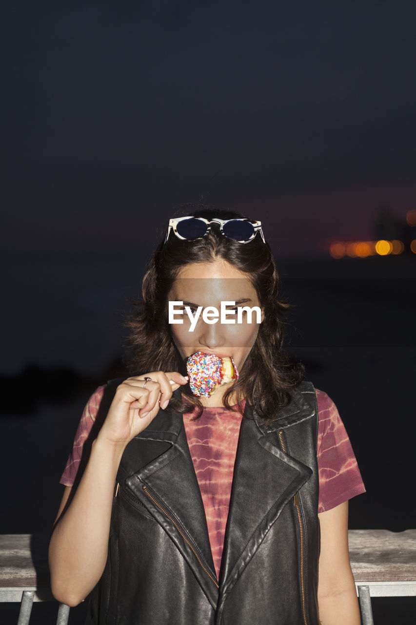 Young woman enjoying a candy apple