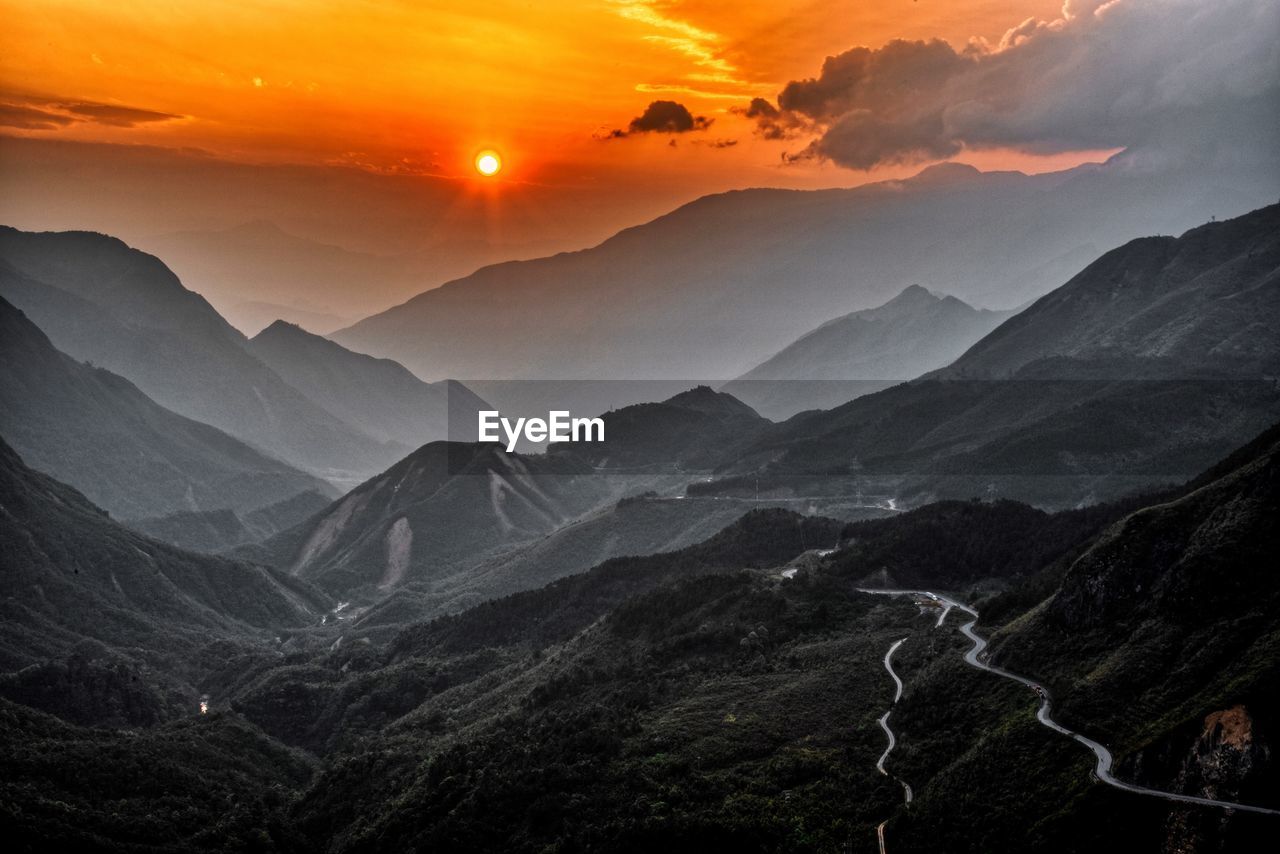 Scenic view of mountains against sky during sunset