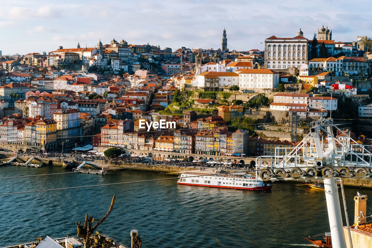 High angle view of river by buildings in city